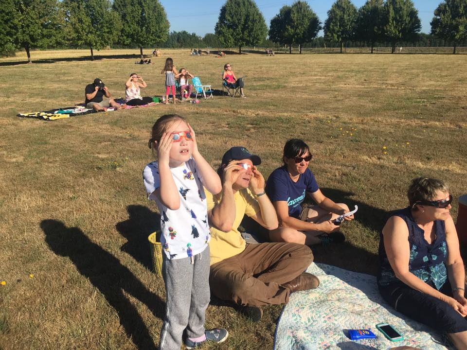 Family Watching Solar Eclipse